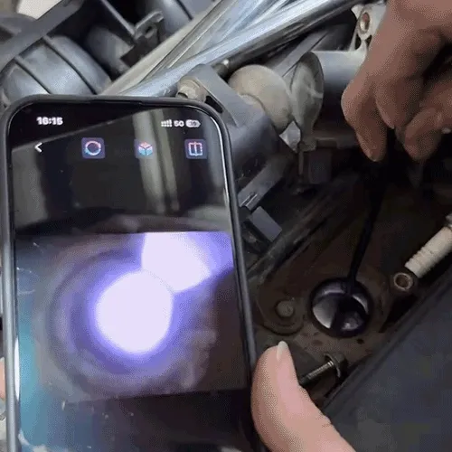 Animated demonstration of a phone-connected inspection camera looking into an engine area