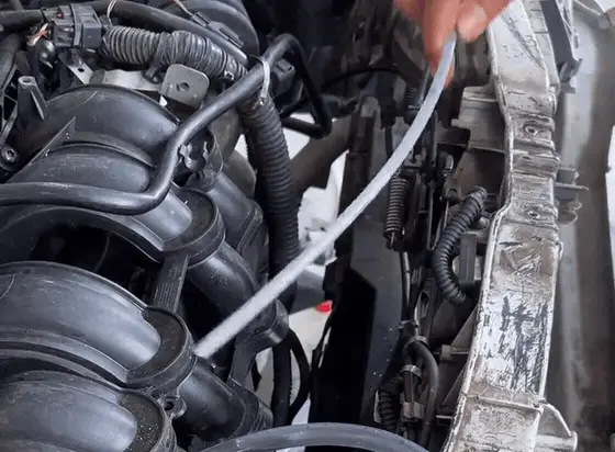 Feeding the 6 mm line down the dipstick tube